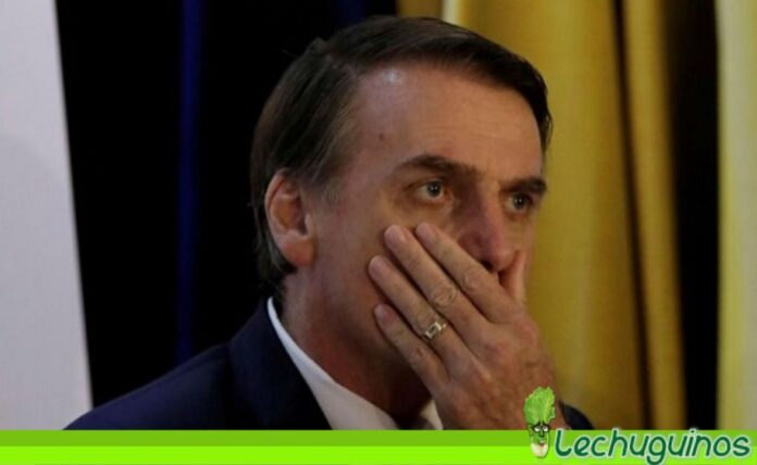 Multan a Bolsonaro y a su hijo por no usar mascarillas en Sao Paulo